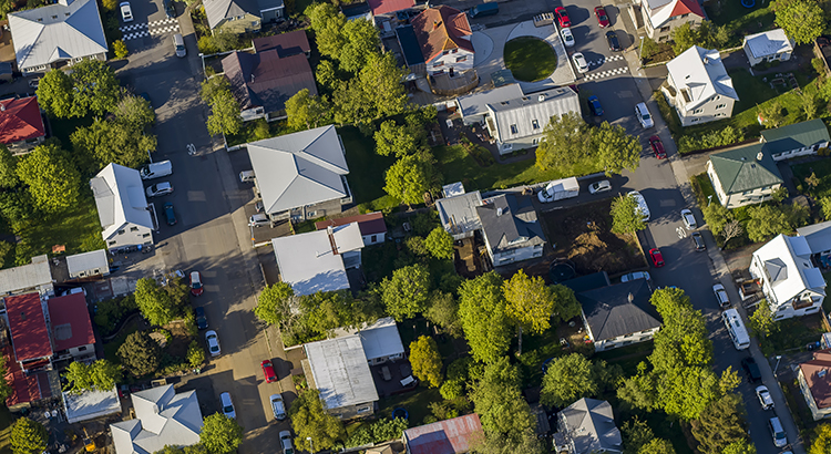 aerial shot of a neighborhood in late afternoon light