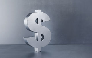 3D dollar sign rendered on a silver background