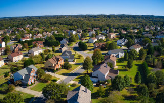 Panoramic aerial view of upscale suburbs on a sunny day