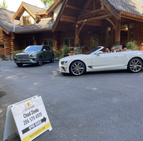 Photo of an open house sign outside of a listing during a real estate tour