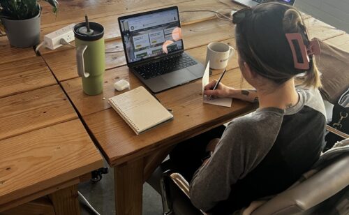 Real estate broker writing follow-up notes as part of weekly business rhythm
