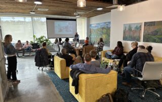 real estate brokers attending the weekly Tuesday meeting before contracts class begins
