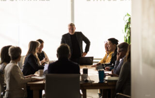 Eric Martin presenting to brokers in a classroom setting, illustrating how in-house collaboration improves client outcomes.